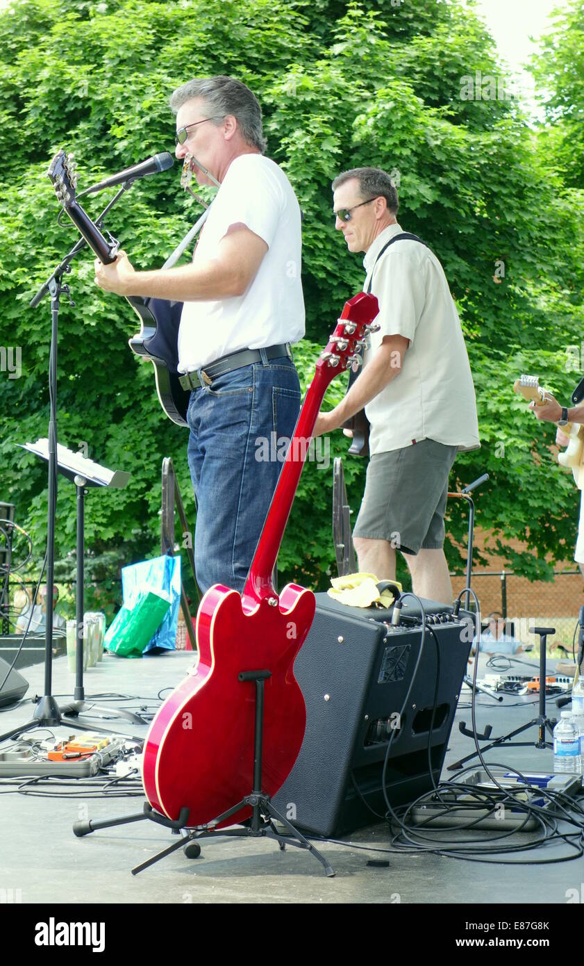 Tribute band playing on stage at an outdoor event outside Toronto, Canada Stock Photo