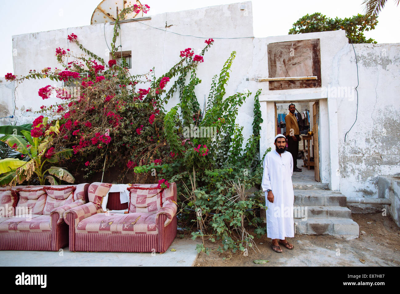 Typical Ras Al Khaimah man in the front of his house in UAE Stock Photo