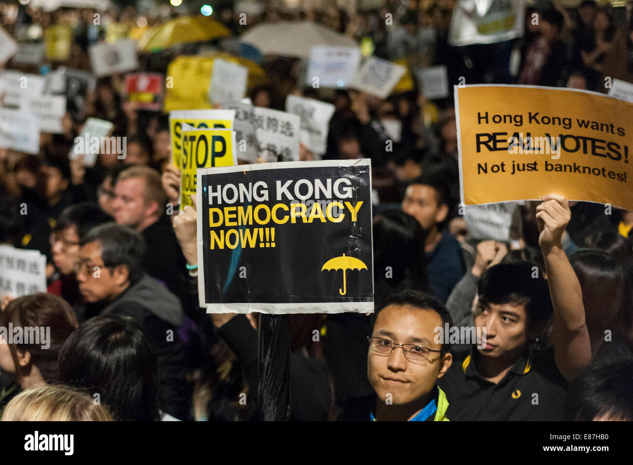 London, UK, 1 October 2014.  Nearly 3,000 people gathered outside the Chinese Embassy in London to support pro-democracy protesters in Hong Kong with many carrying umbrellas or wearing a yellow ribbon, the symbol of protests in the former British colony.  Credit:  Stephen Chung/Alamy Live News Stock Photo