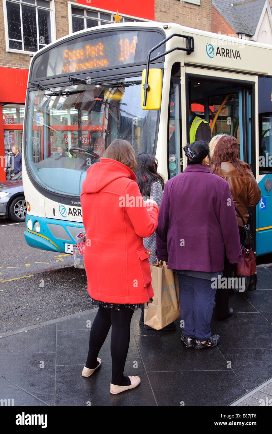 queue of people boarding Arriva single decker bus, Leicester, England, UK Stock Photo