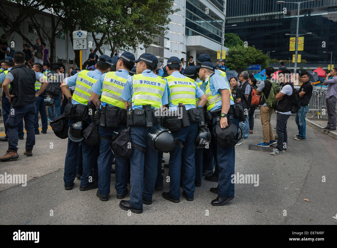 Police huddled together against Occupy Central Stock Photo