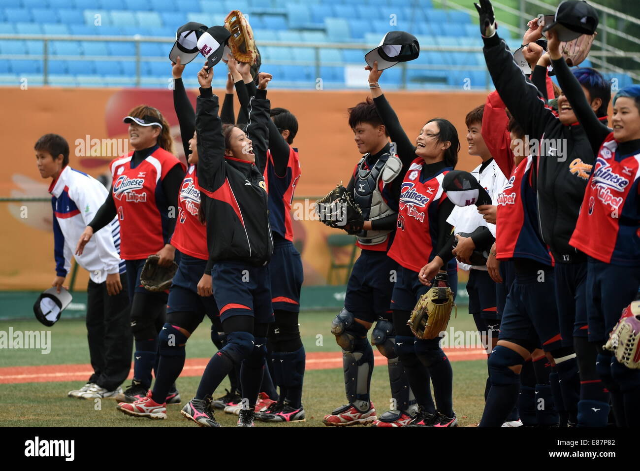 Incheon, South Korea. 2nd Oct, 2014. Players of Chinese Taipei celebrate after the women's softball final against China at the 17th Asian Games in Incheon, South Korea, Oct. 2, 2014. China lost 3-4 and got the bronze medal. © Gao Jianjun/Xinhua/Alamy Live News Stock Photo
