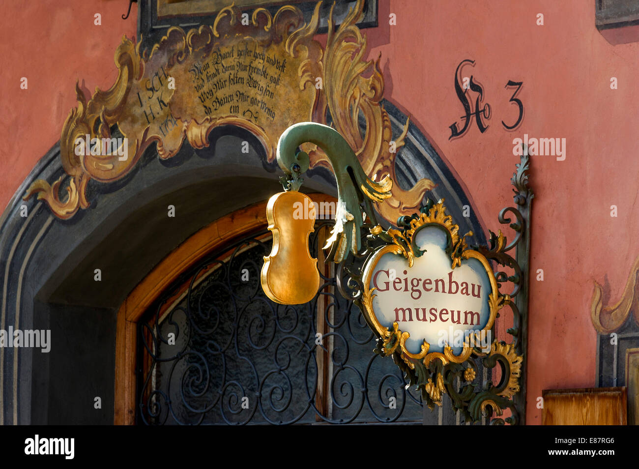 Wrought iron hanging shop sign of the Geigenbaumuseum violin making museum, Mittenwald, Werdenfelser Land, Upper Bavaria Stock Photo