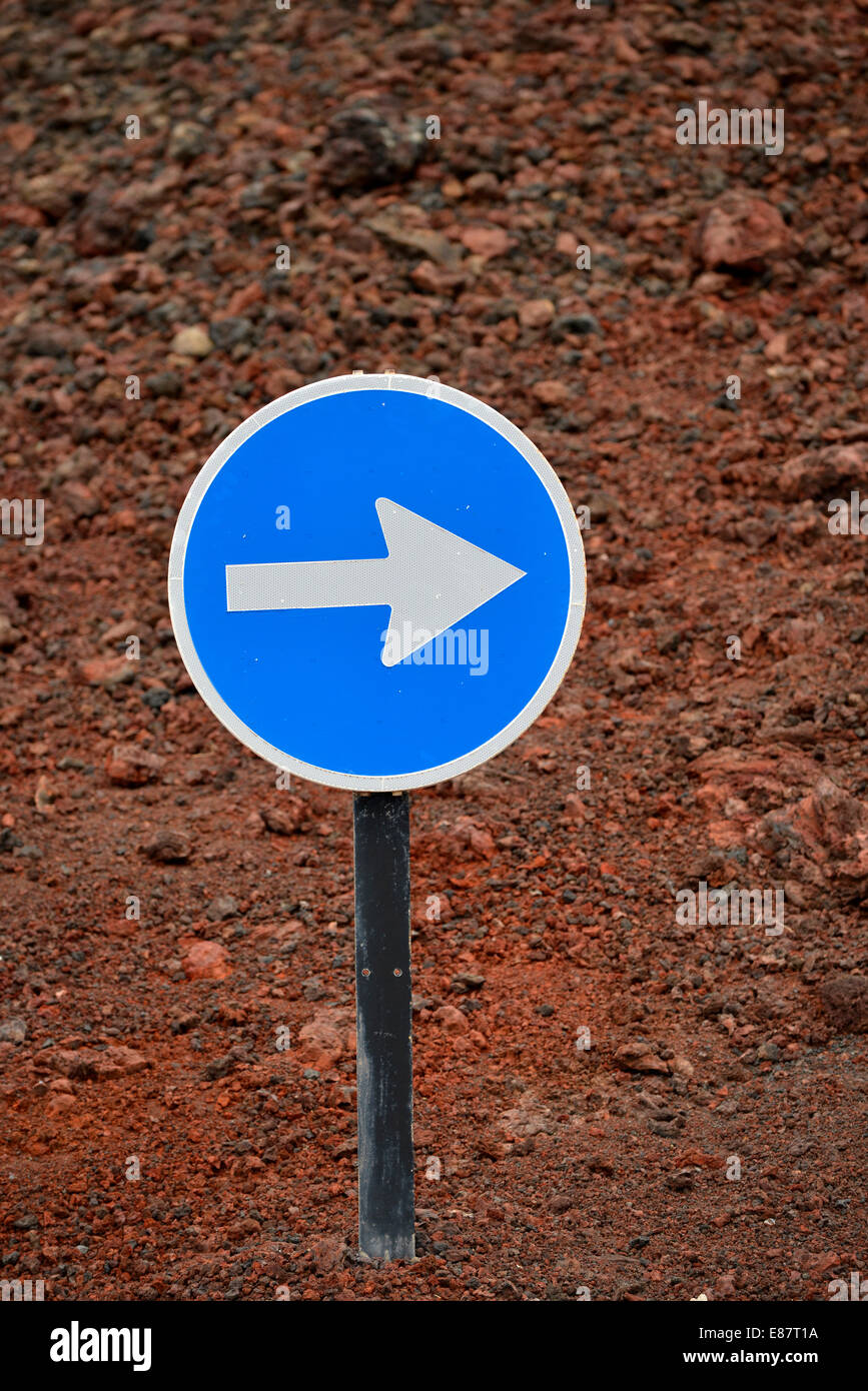 Traffic sign, arrow to the right, Timanfaya National Park, Montañas del Fuego, Fire Mountains, Lanzarote, Canary Islands, Spain Stock Photo