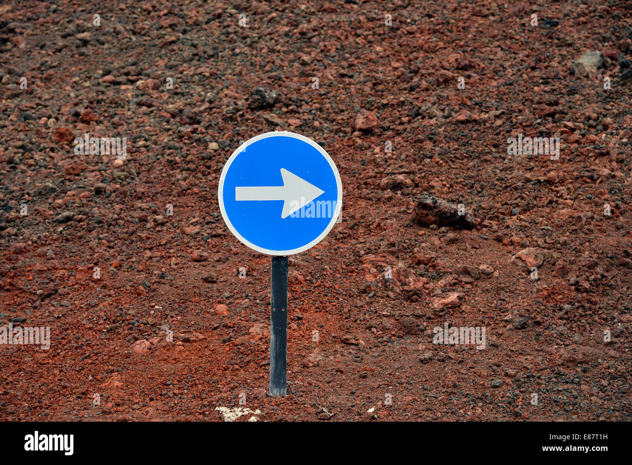 Traffic sign, arrow to the right, Timanfaya National Park, Montañas del Fuego, Fire Mountains, Lanzarote, Canary Islands, Spain Stock Photo