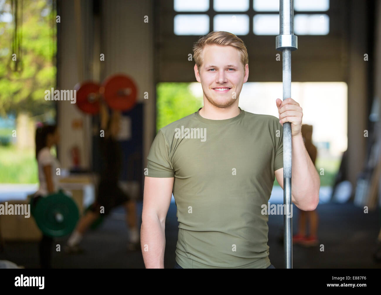 Athlete Holding Weightlifting Bar At Gym Stock Photo Alamy