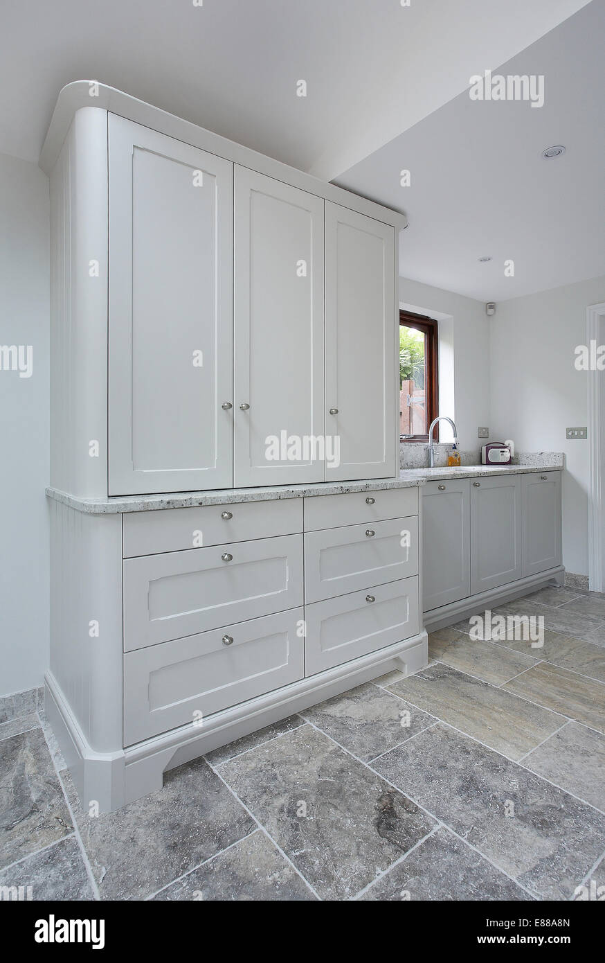 A modern white kitchen.cupboard and sink unit Stock Photo - Alamy
