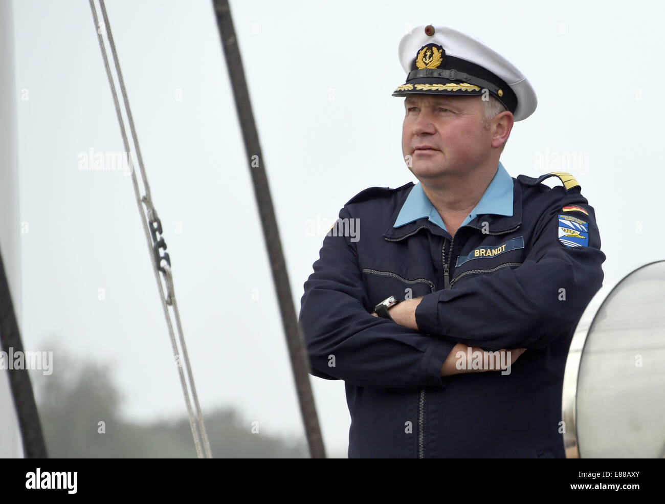 Kiel, Germany. 02nd Oct, 2014. Kiel, Germany. 2nd October, 2014. Captain Nils Brandt stands on deck as the Gorch Fock leaves port in Kiel, Germany, 02 October 2014. The navy's sailing training ship is heading out to sea on its 165th training trip. It will dock in La Rochelle, Malaga and Lisbon. It will return on 19 December. © dpa picture alliance/Alamy Live News Credit:  dpa/Alamy Live News Stock Photo