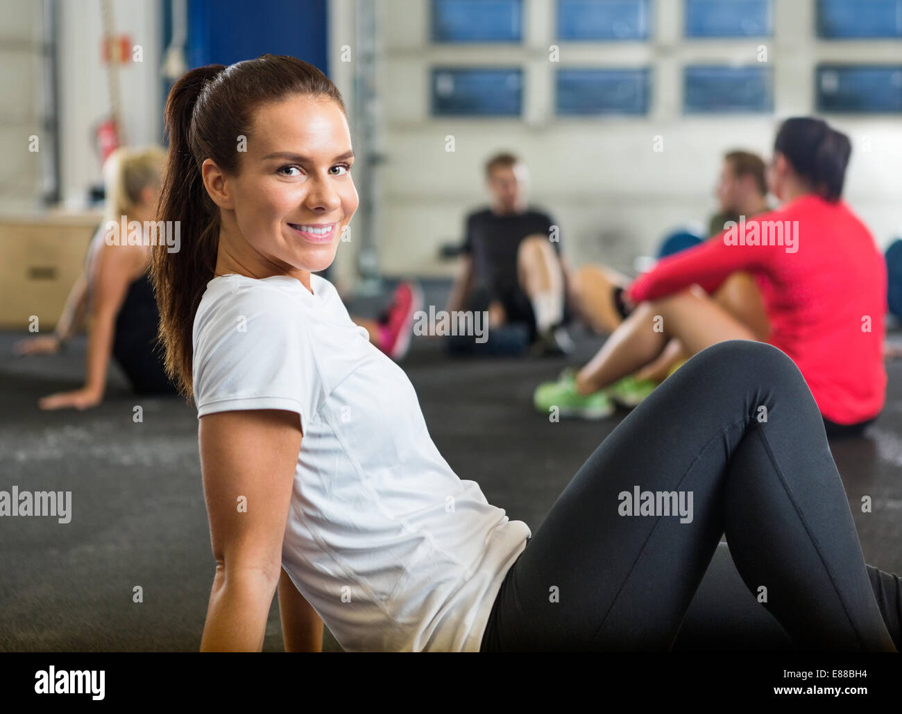 Smiling Woman Exercising In Cross Training Box Stock Photo