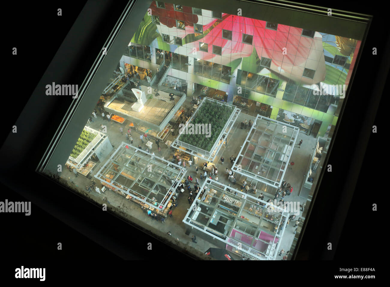 Rotterdam, Netherlands. 30th Sept, 2014. Stalls in the Markthal Rotterdam in Rotterdam, seen through a skylight. The covered market was designed by architects MVRDV and the interior bears the biggest artwork in the Netherlands, 'The Horn of Plenty' by Arno Coenen and Iris Roskam. The market was officially opened by Queen Maxima on 1 October 2014. Credit:  Stuart Forster/Alamy Live News Stock Photo