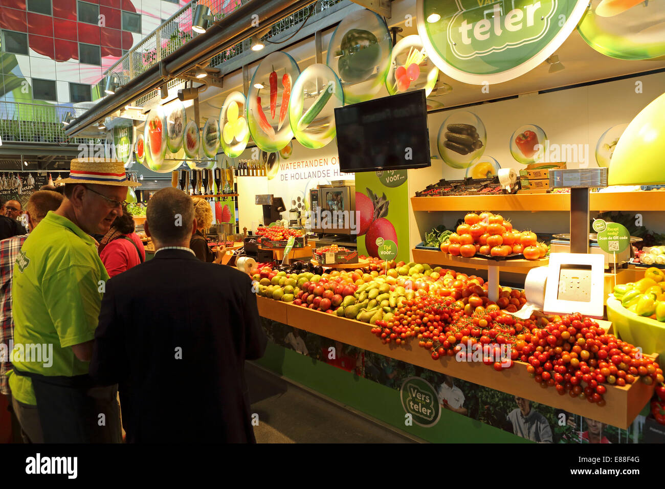 Rotterdam, Netherlands. 30th Sept, 2014. A fruit and vegetable stall in the Markthal Rotterdam in Rotterdam, the Netherlands. The covered market was designed by architects MVRDV and the interior bears the biggest artwork in the Netherlands, 'The Horn of Plenty' by Arno Coenen and Iris Roskam. The market was officially opened by Queen Maxima on 1 October 2014. Credit:  Stuart Forster/Alamy Live News Stock Photo