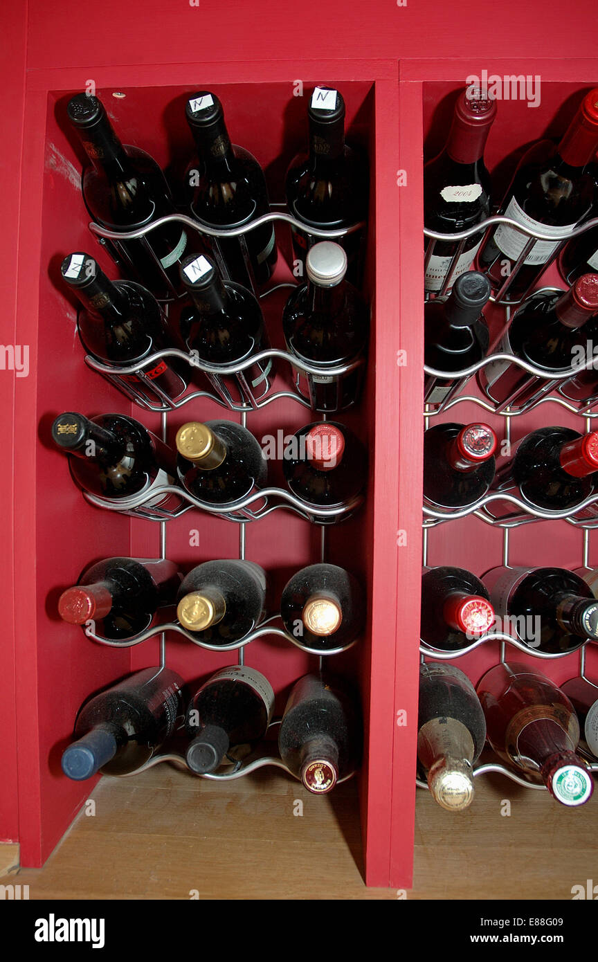 close up of wine storage in red cupboard Stock Photo Alamy