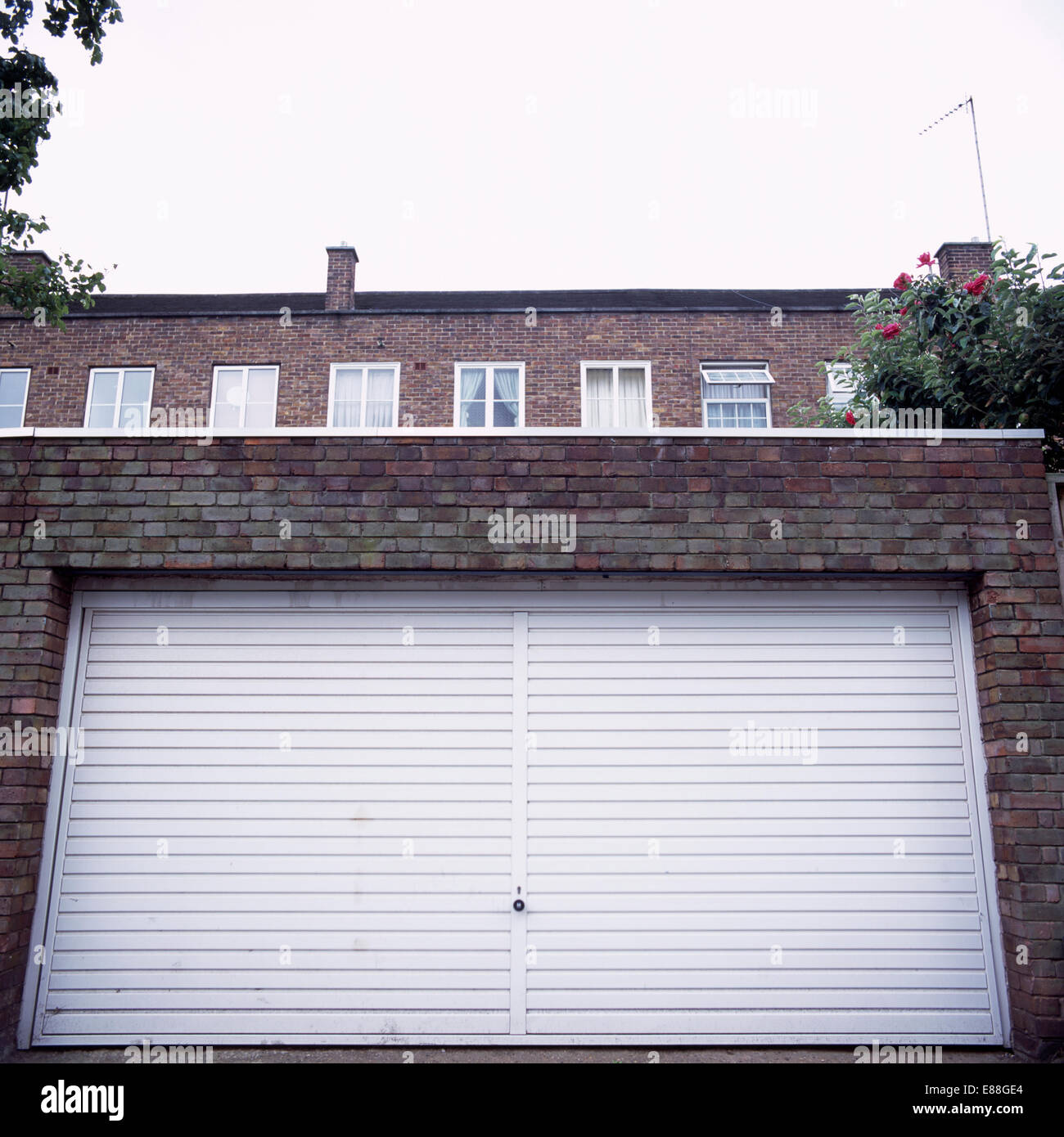 Garage with closed white metal doors Stock Photo