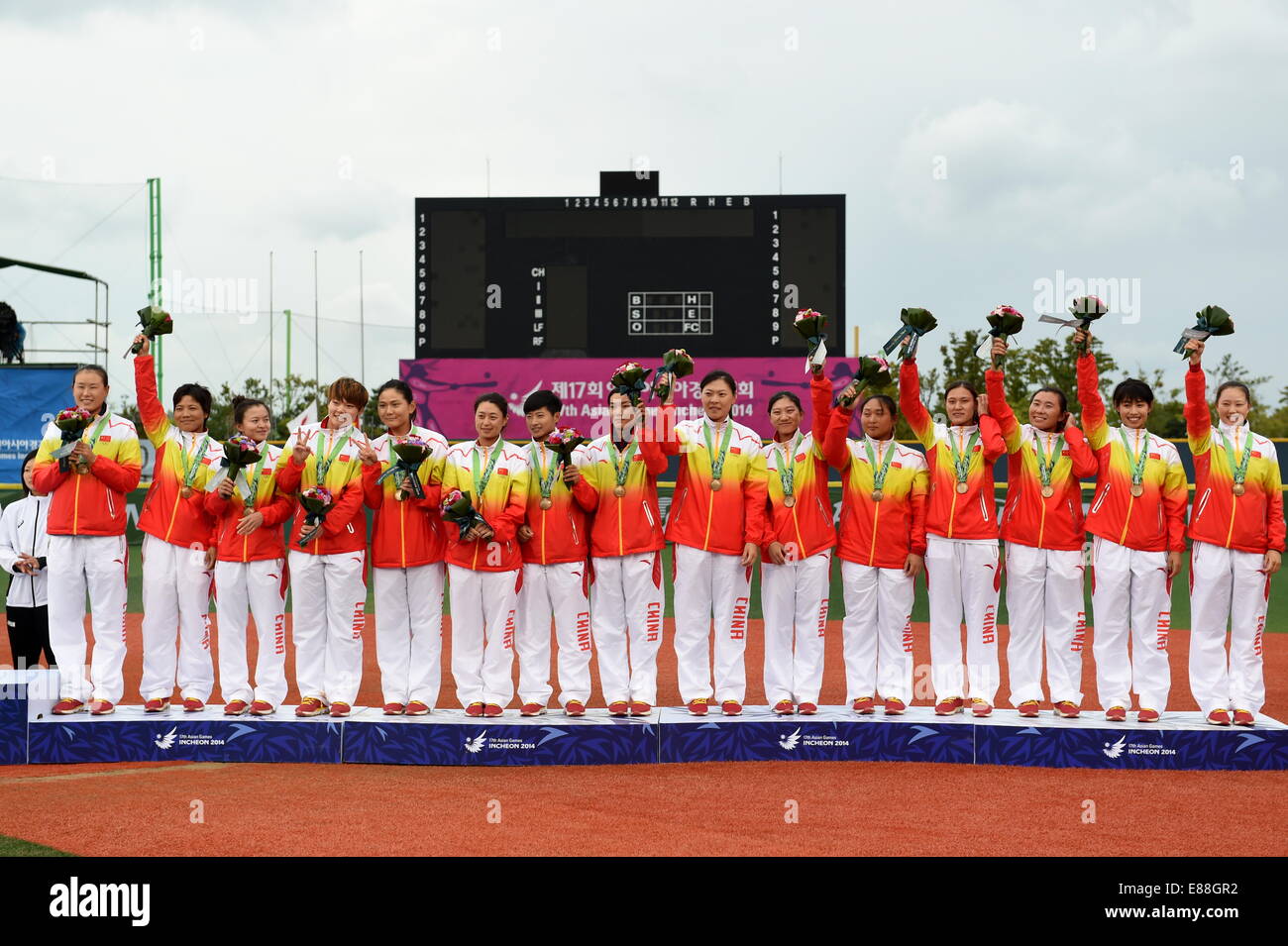 (141002) -- INCHEON, Oct. 2, 2014 (Xinhua) -- Bronze medalists players of China pose on the podium during awarding ceremony of the women's softball contest at the 17th Asian Games in Incheon, South Korea, Oct. 2, 2014. (Xinhua/Gao Jianjun)(mcg) Stock Photo