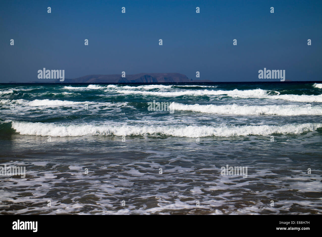 Rough sea in Greece with islands in background Stock Photo