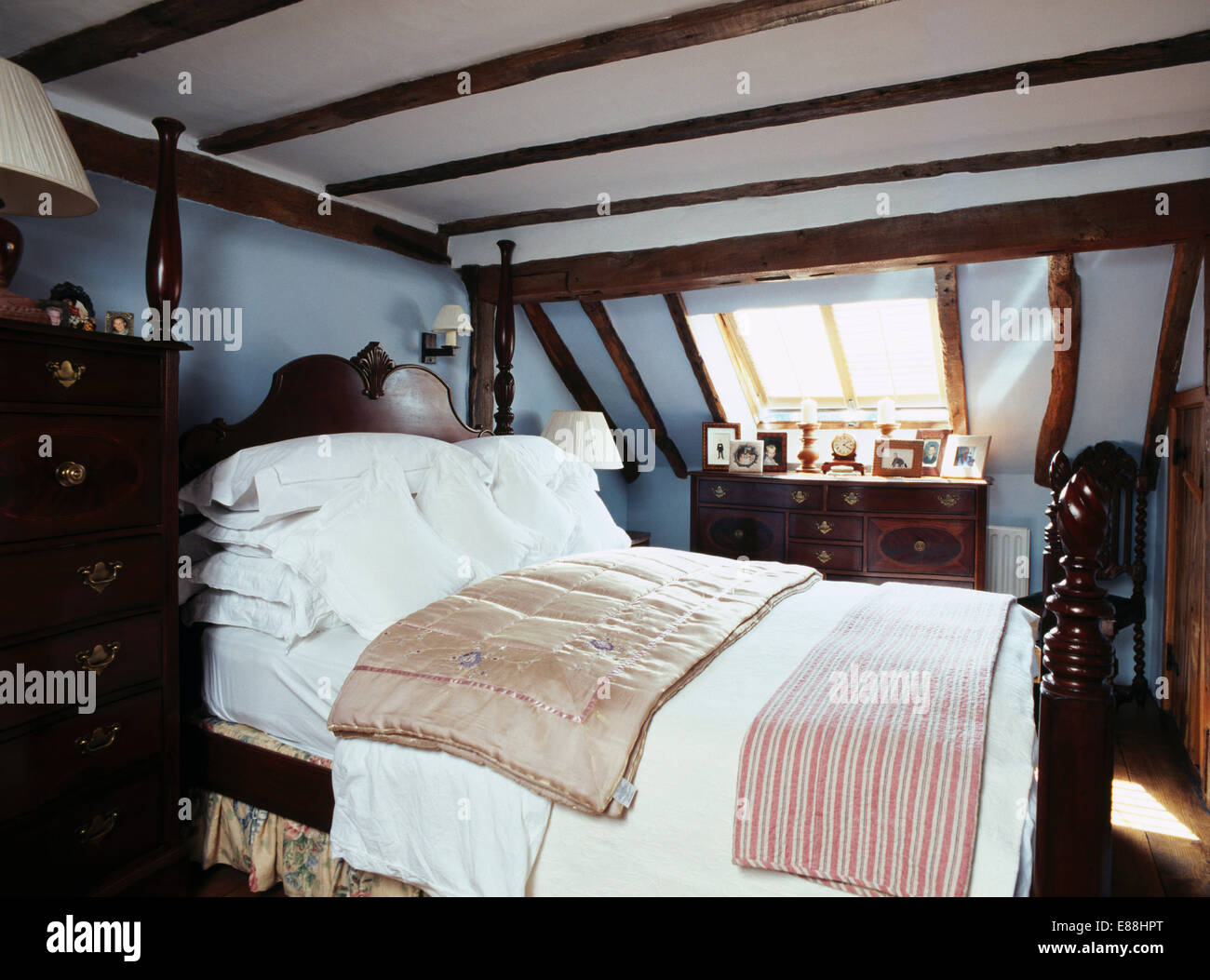 Pastel Blue Attic Bedroom With White Pillows And Silk Quilt
