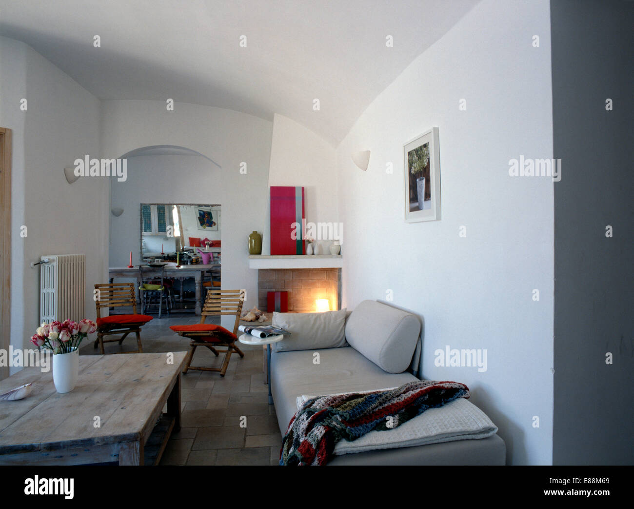 Picture of Wooden coffee table and grey sofa in modern white Italian living room ...