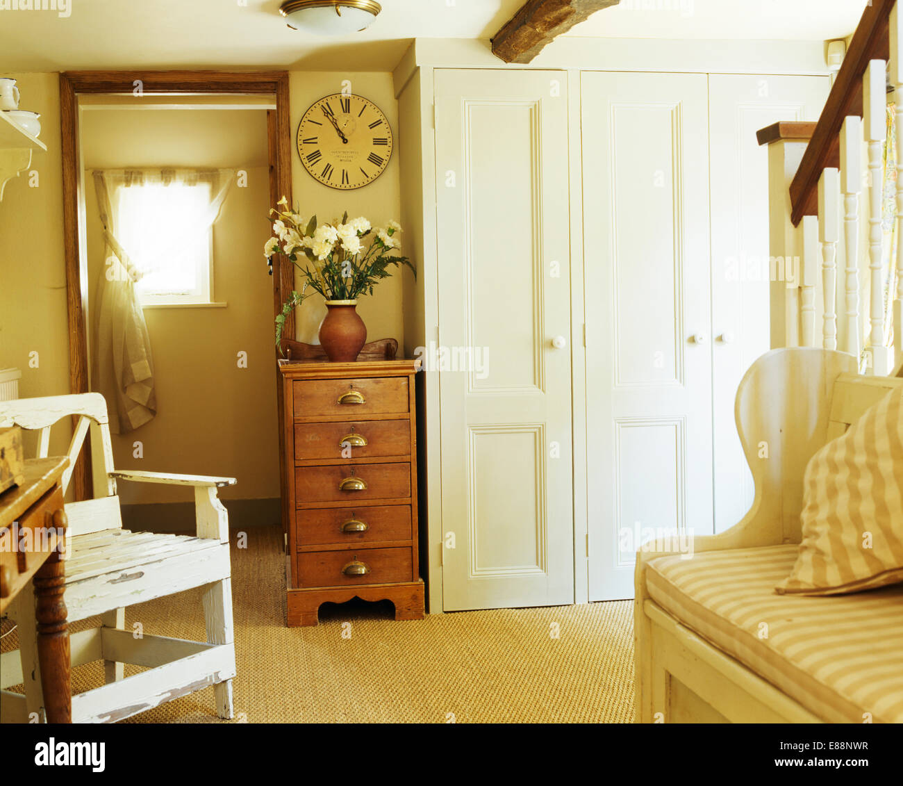 Clock Above Pine Chest Of Drawers In Cottage Hall With Seagrass