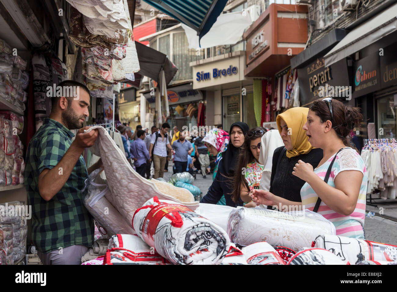 Turkish women making a bargain with a vendor (seller), street linking
