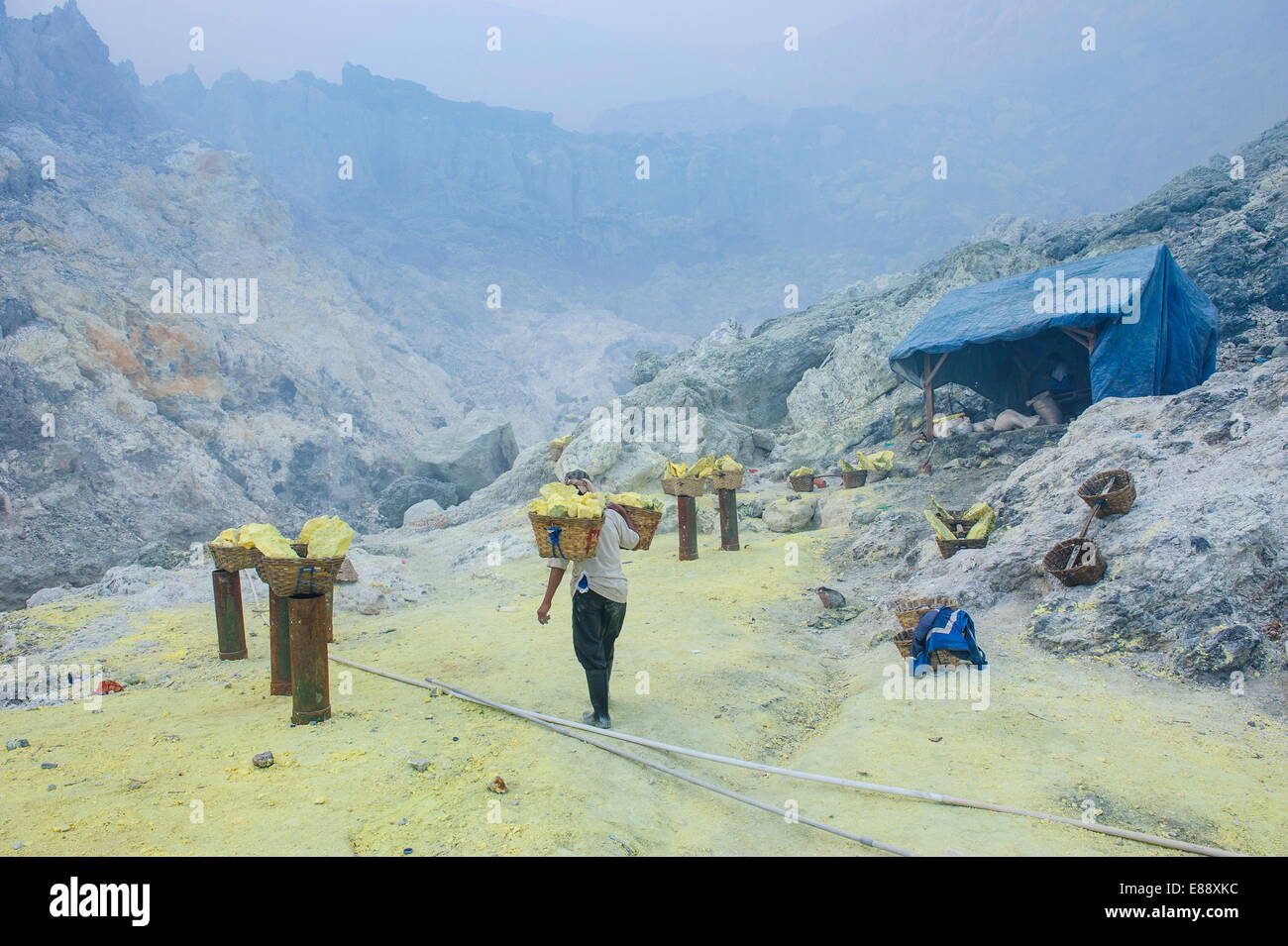 Fully loaded baskets of sulphur ready to be carried  out of the Ijen Volcano, Java, Indonesia, Southeast Asia, Asia Stock Photo