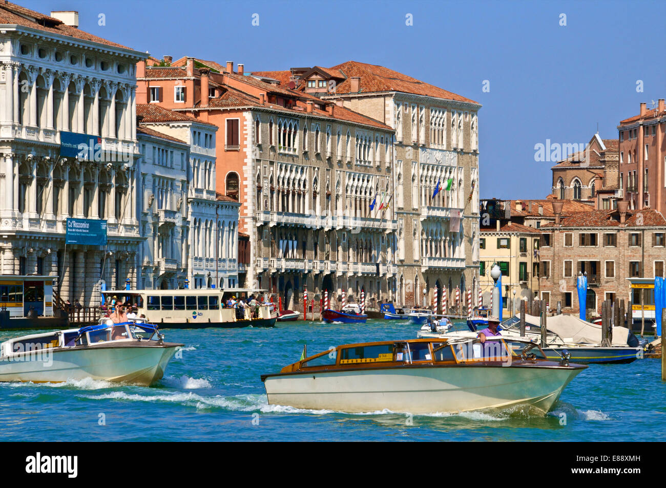 Ca Rezzonico palace facade and other palaces, along the Grand Canal, and boats, San Marco, Venice, UNESCO Site, Veneto, Italy Stock Photo