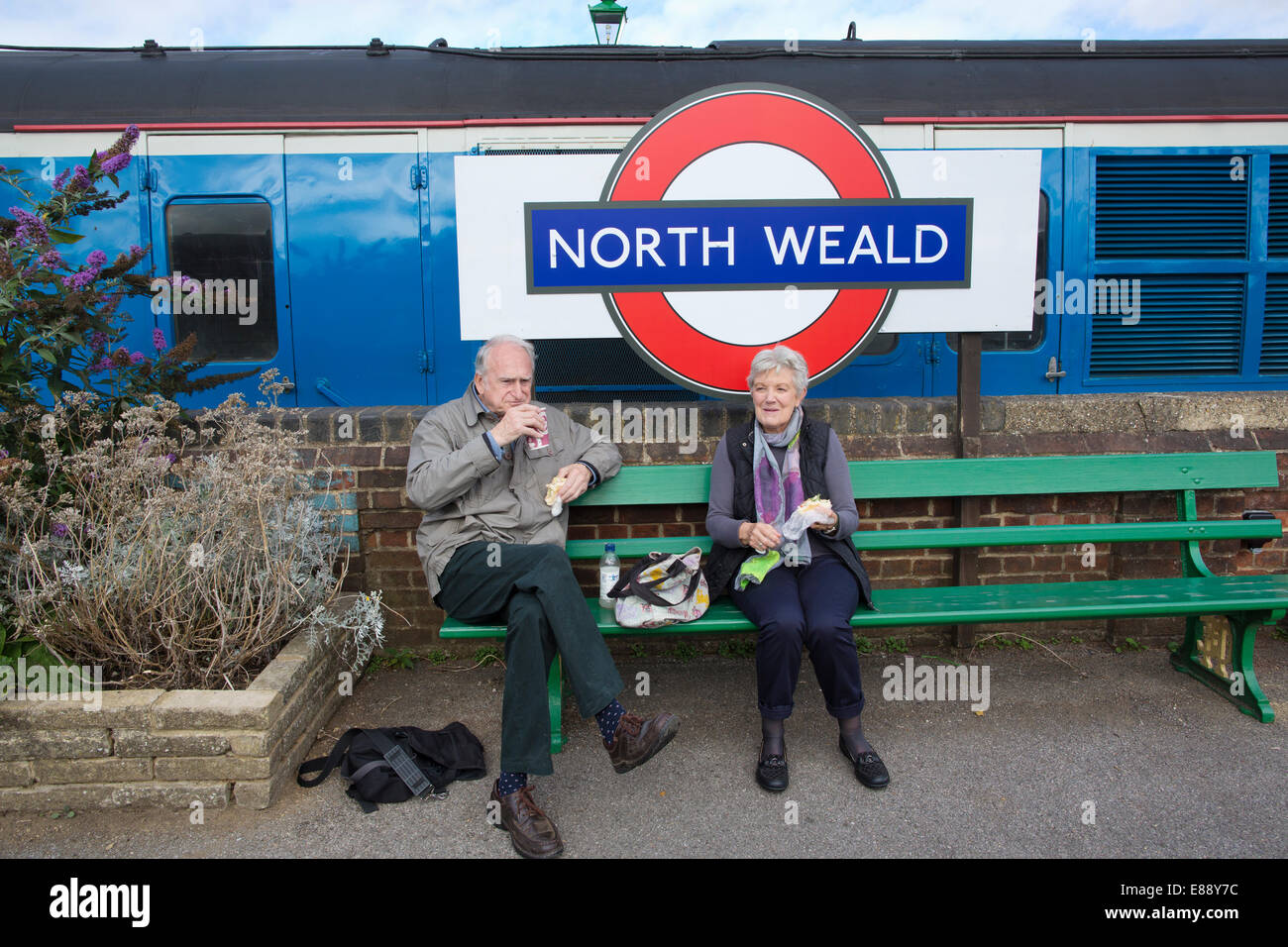 Trainspotters enjoying their packed lunch at North Weald Station to Ongar, Essex, England, UK Stock Photo