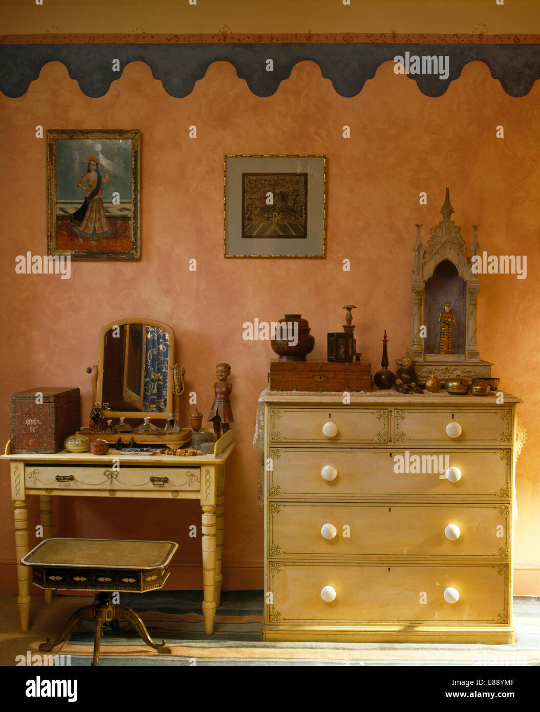Blue Painted Border On Pink Wall Above Pine Chest Of Drawers With