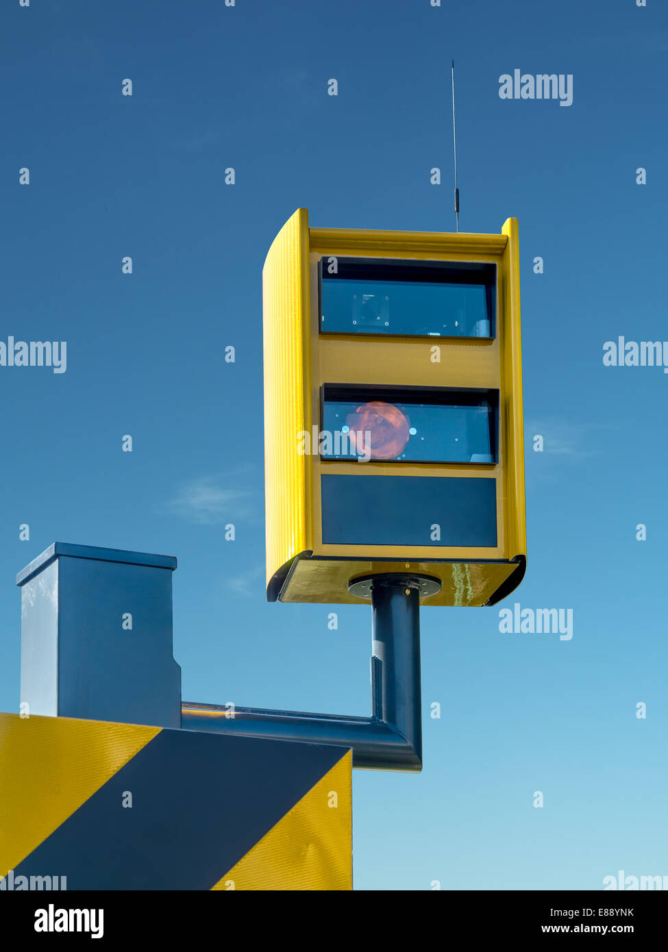 Traffic speed monitoring camera, against blue sky Stock Photo