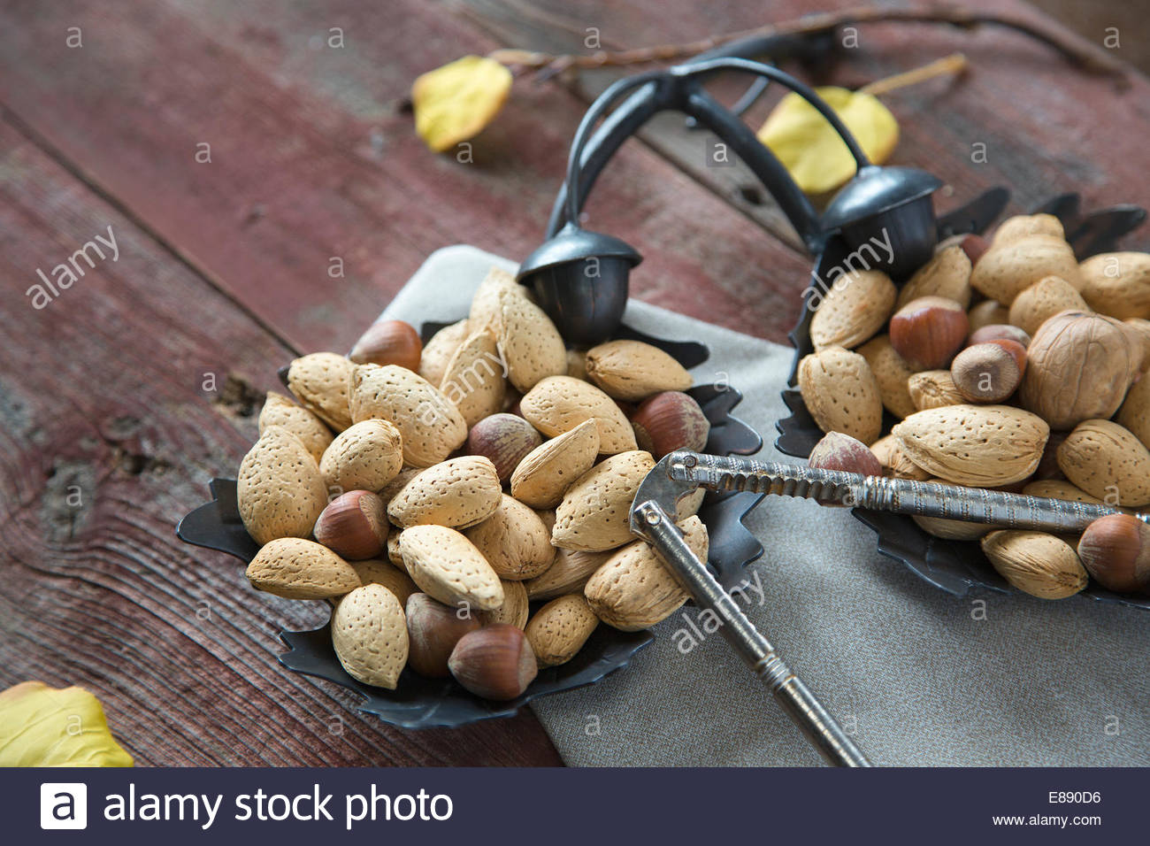 Hazelnuts and almond nuts with nutcracker Stock Photo