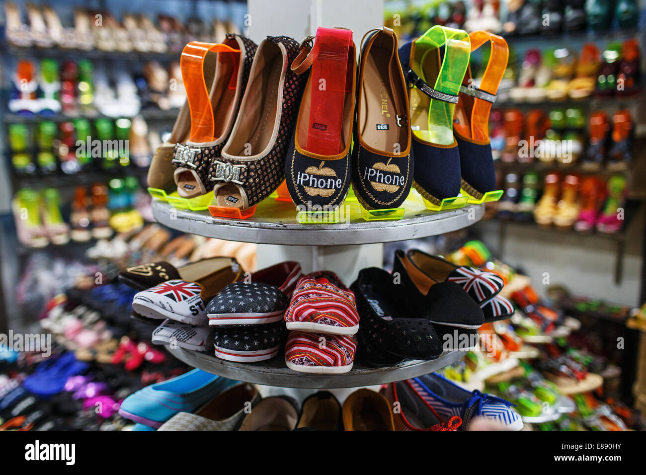 Women shoes with iPhone logo on sale at the market in Sihanoukville, Cambodia Stock Photo