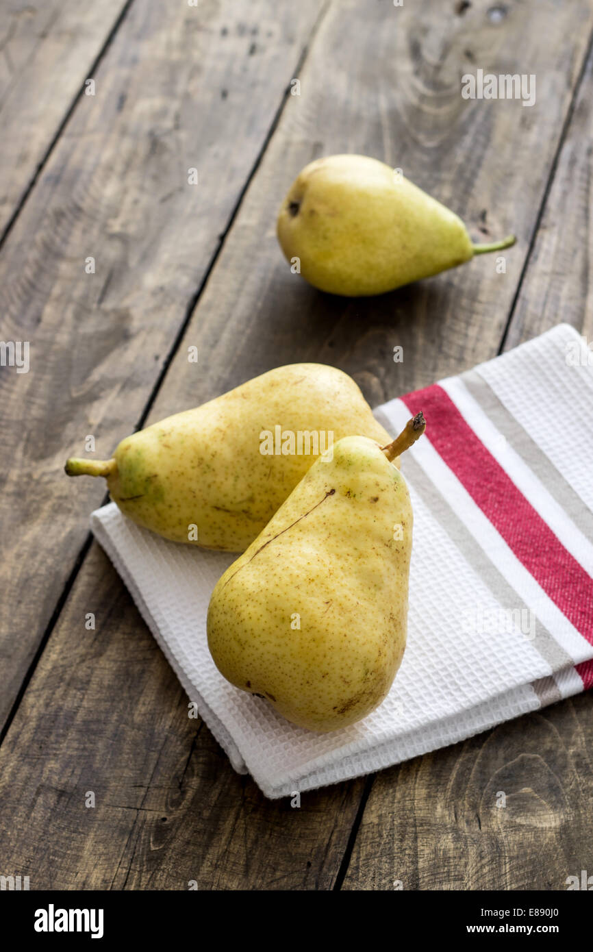 organic pears on rustic wooden background Stock Photo
