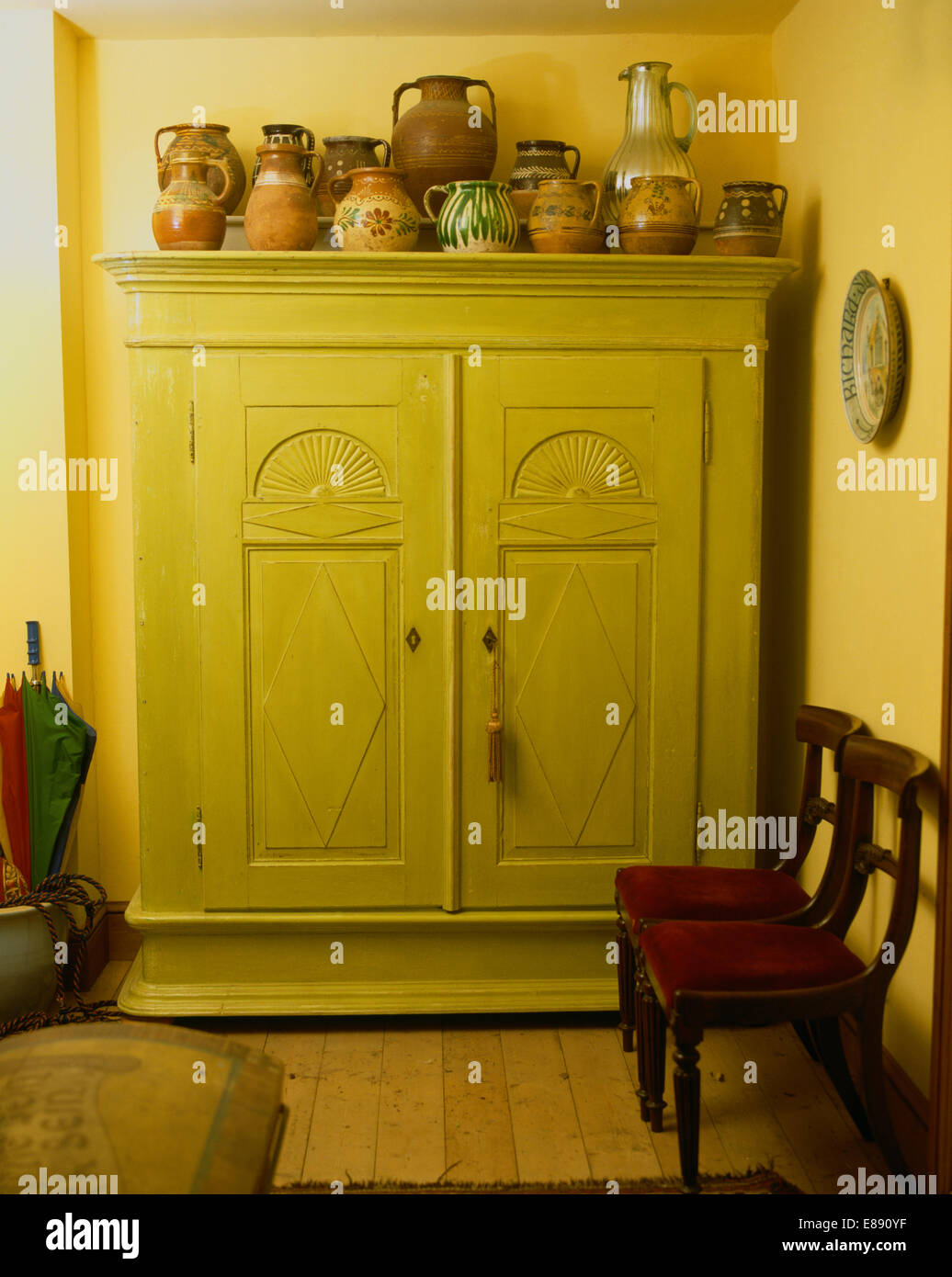 Pastel green cupboard in traditional hall Stock Photo Alamy