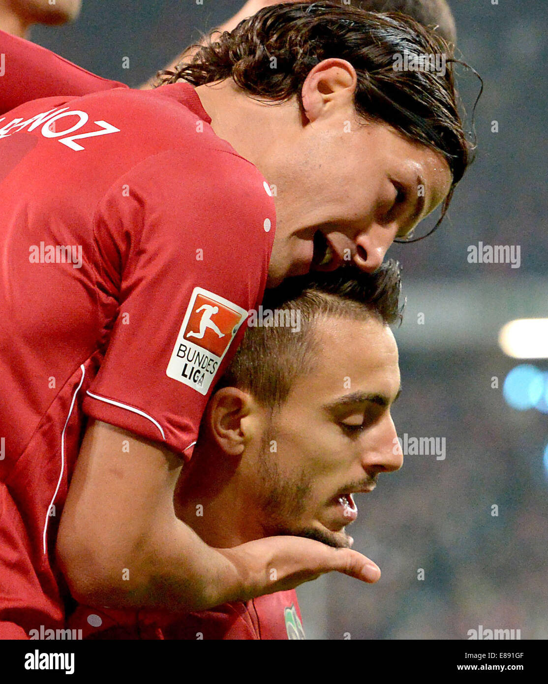 Hanover, Germany. 24th Sep, 2014. Hannover's Joselu (BELOW)celebrates his success of 1:0 against FC Koln with Miiko Albornoz at the Bundesliga game between Hannover 96 and FC Koln at the HDI Arena in Hanover, Germany, 24 September 2014. Photo: Peter Steffen/dpa/Alamy Live News Stock Photo