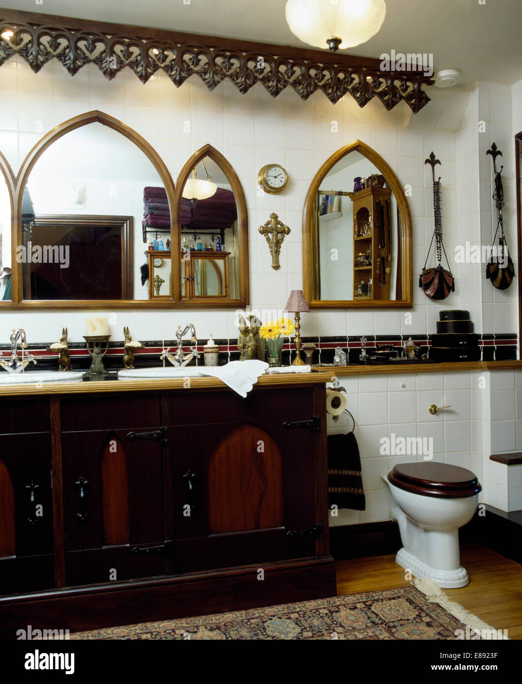 Carved Wooden Cornice And Mitre Shaped Mirrors On Wall Above