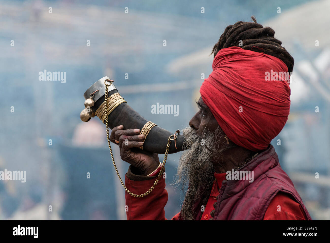 Sadhu blowing traditional bugle on the way to Gangasagar festival, West