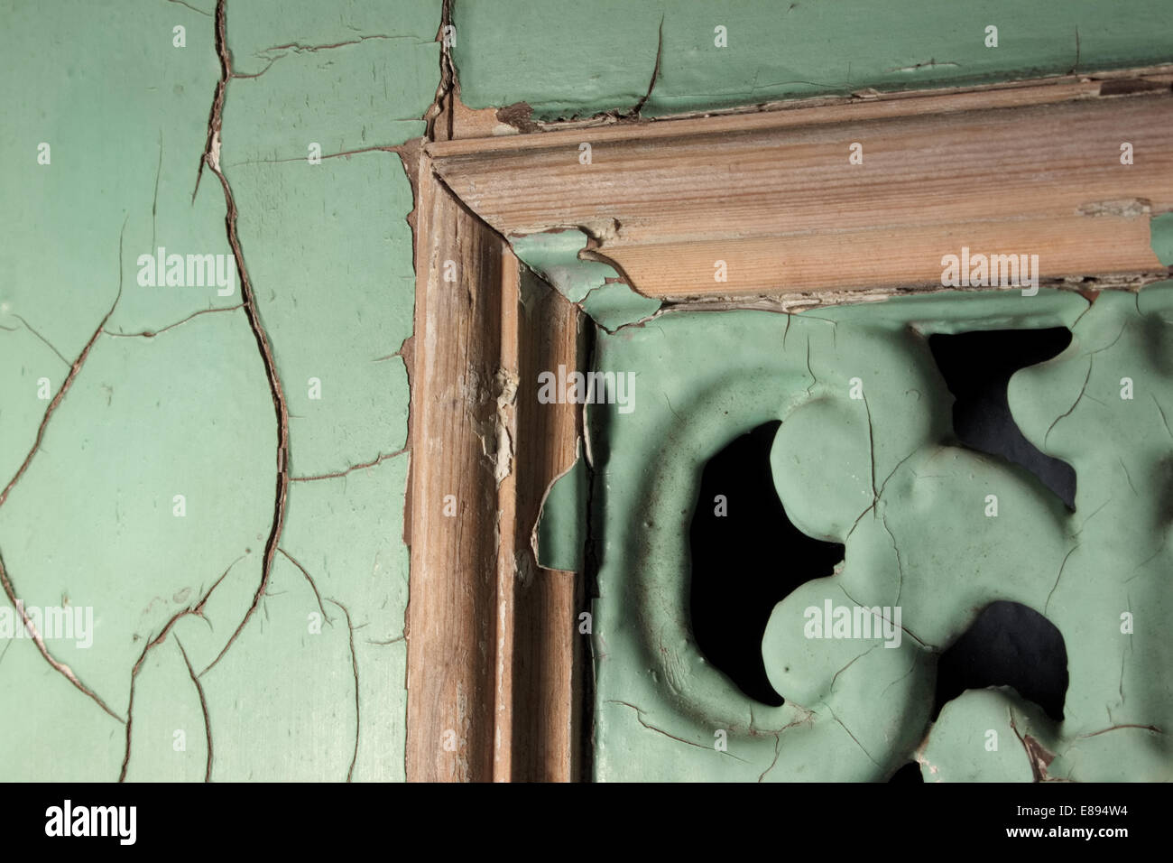 Distressed green Victorian door with iron work Stock Photo