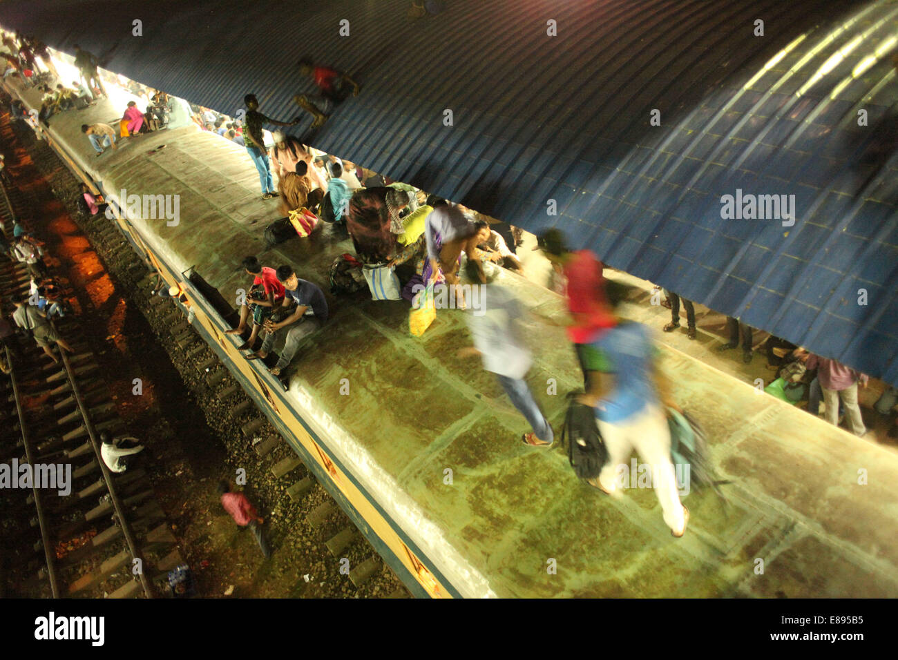 Dhaka, Bangladesh. 2nd Oct, 2014. People travel on a train leaving for their hometowns for the upcoming festival Eid-ul-Adha at the Airport Railway Station.Millions of Bangladeshis are expected to travel home, Journeys on overcrowded trains and boats make the return dangerous. Credit:  Zakir Hossain Chowdhury/ZUMA Wire/Alamy Live News Stock Photo