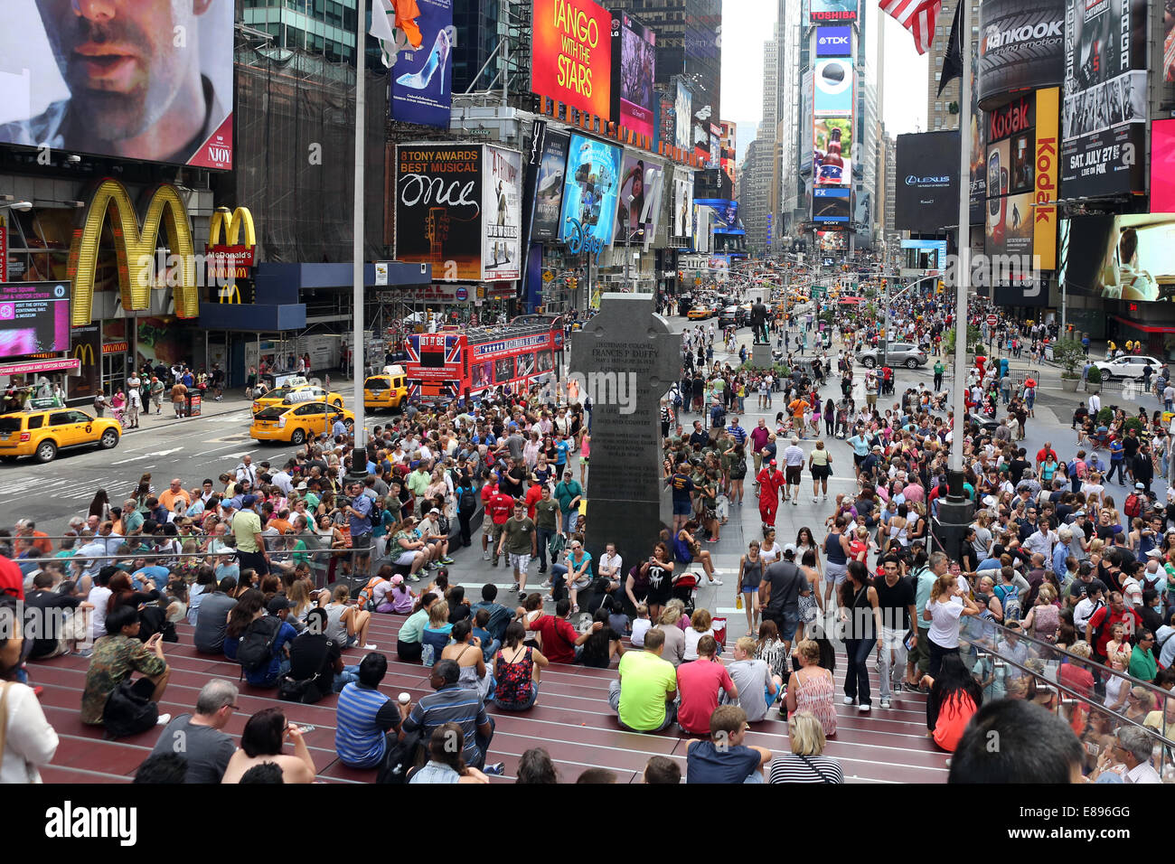 New York, United States, people sitting on the red stairs in Times ...