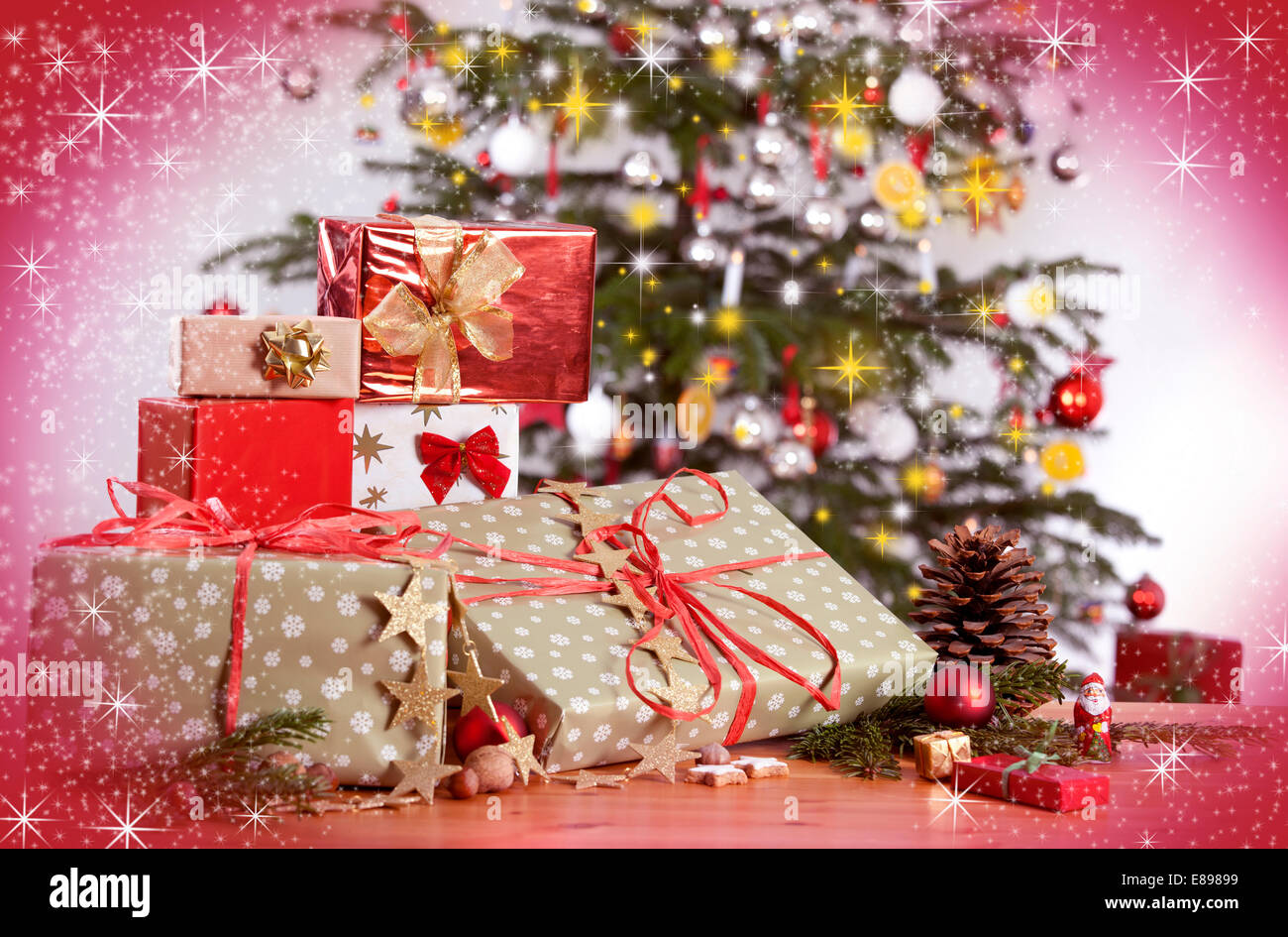 many gifts on a table and christmas tree with red glittering background - How Many Gifts For Christmas many gifts on a table and christmas tree with red glittering background - How Many Gifts For Christmas