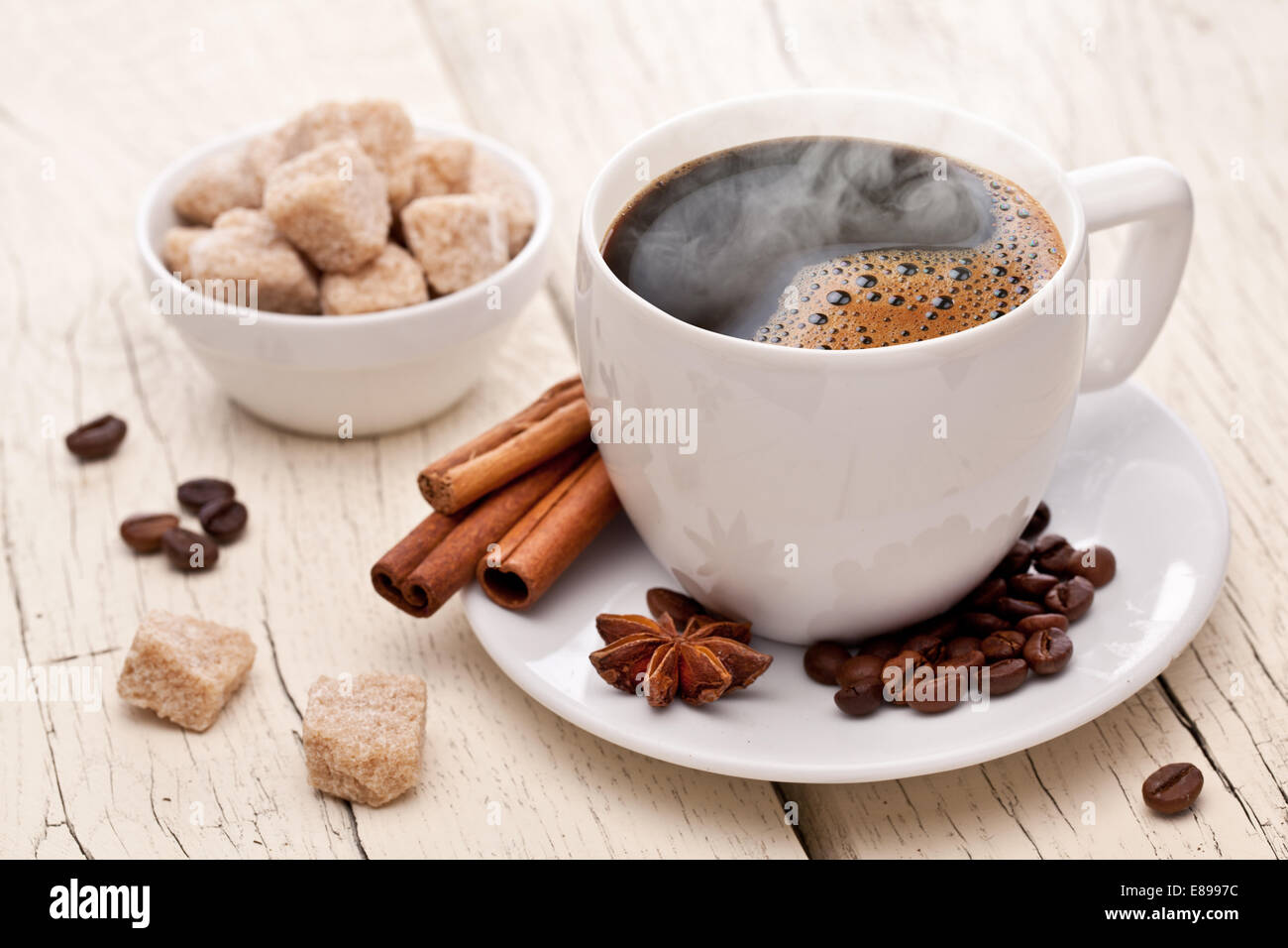 Cup of hot coffee on an old wooden table. Stock Photo