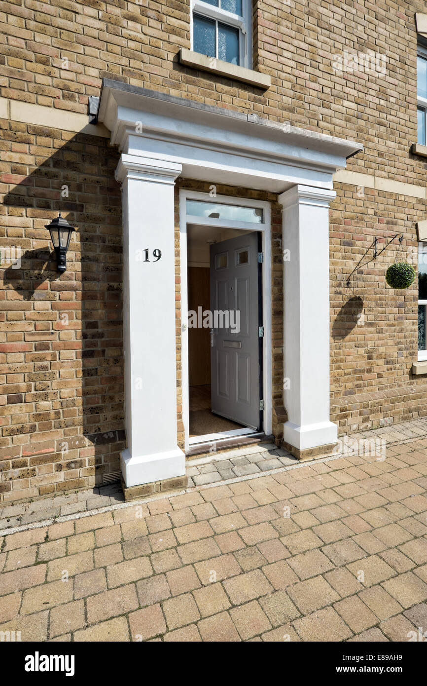 A small portico surrounding the front door of a modern development home in the English town of Swindon, Wiltshire, UK Stock Photo