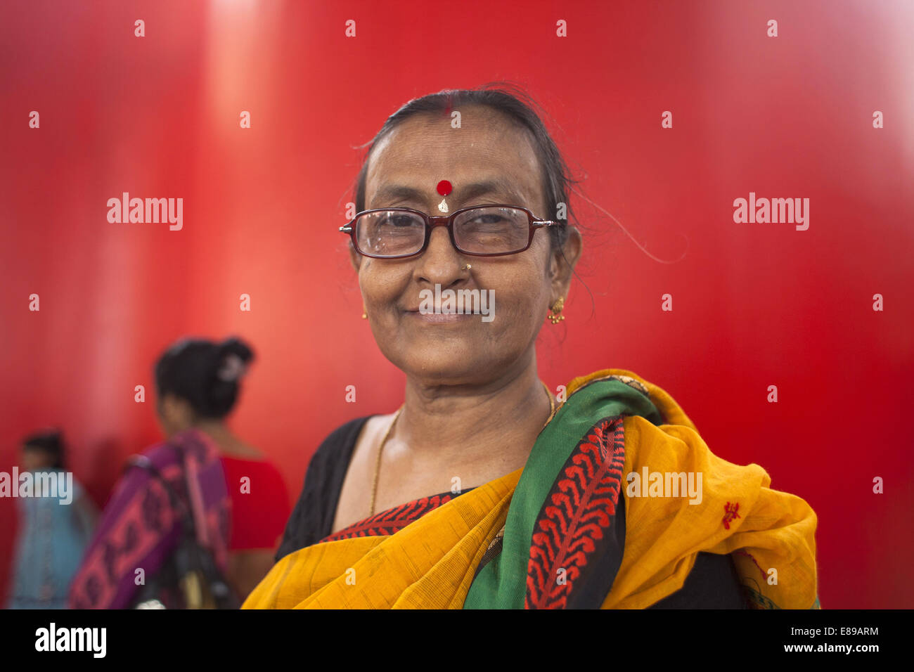 Dhaka, Bangladesh. 2nd Oct, 2014. A hindu old women attended to Durga puja festival.Thousands of Bangladeshi devotees celebrate the traditional festival Durga Puja, the worshipping of the Hindu goddess Durga. Common customs include the application of Sindoor powder on married women, the sacrifice of animals and the worship of deities Credit:  Zakir Hossain Chowdhury/ZUMA Wire/Alamy Live News Stock Photo