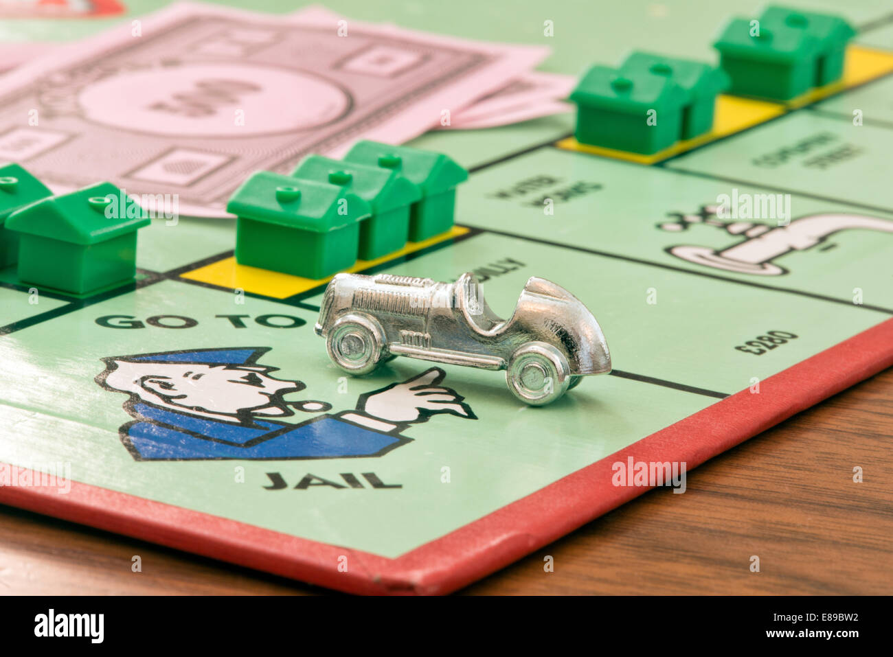 The metal car charm on the go to jail square of the Waddingtons Monopoly board game Stock Photo