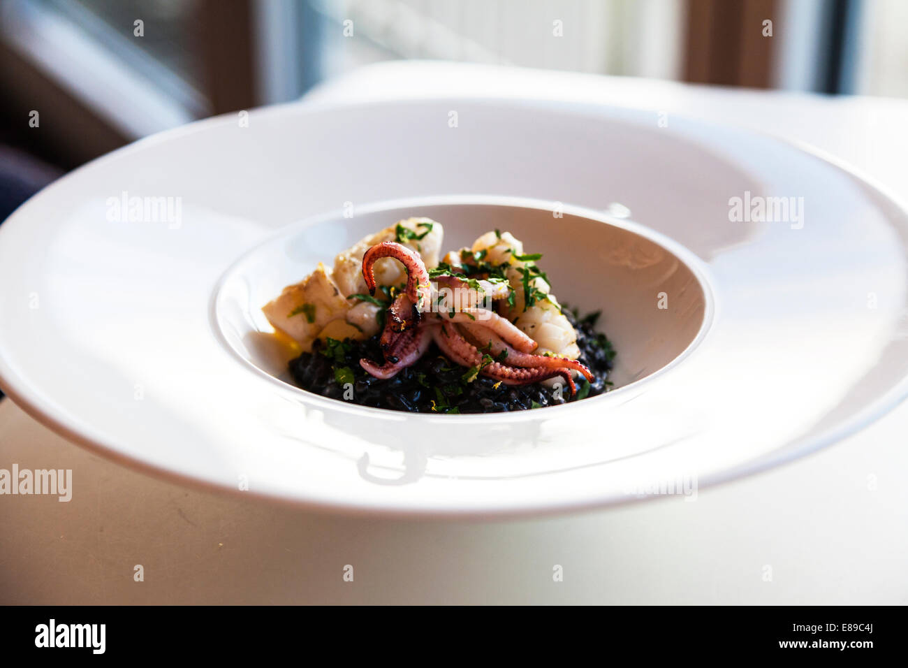 Squid meal food Fifteen Jamie Oliver's Cornwall Cornish west country typical Stock Photo