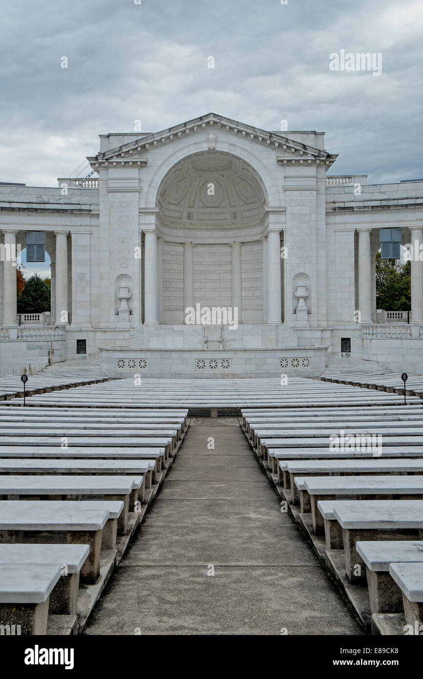 A view of the inside of an empty Arlington Memorial Amphitheater with a stormy cloudy sky. One of the inscriptions above the dome is 'We Here Highly Resolve That These Dead Shall Not Have Died In Vain' Stock Photo