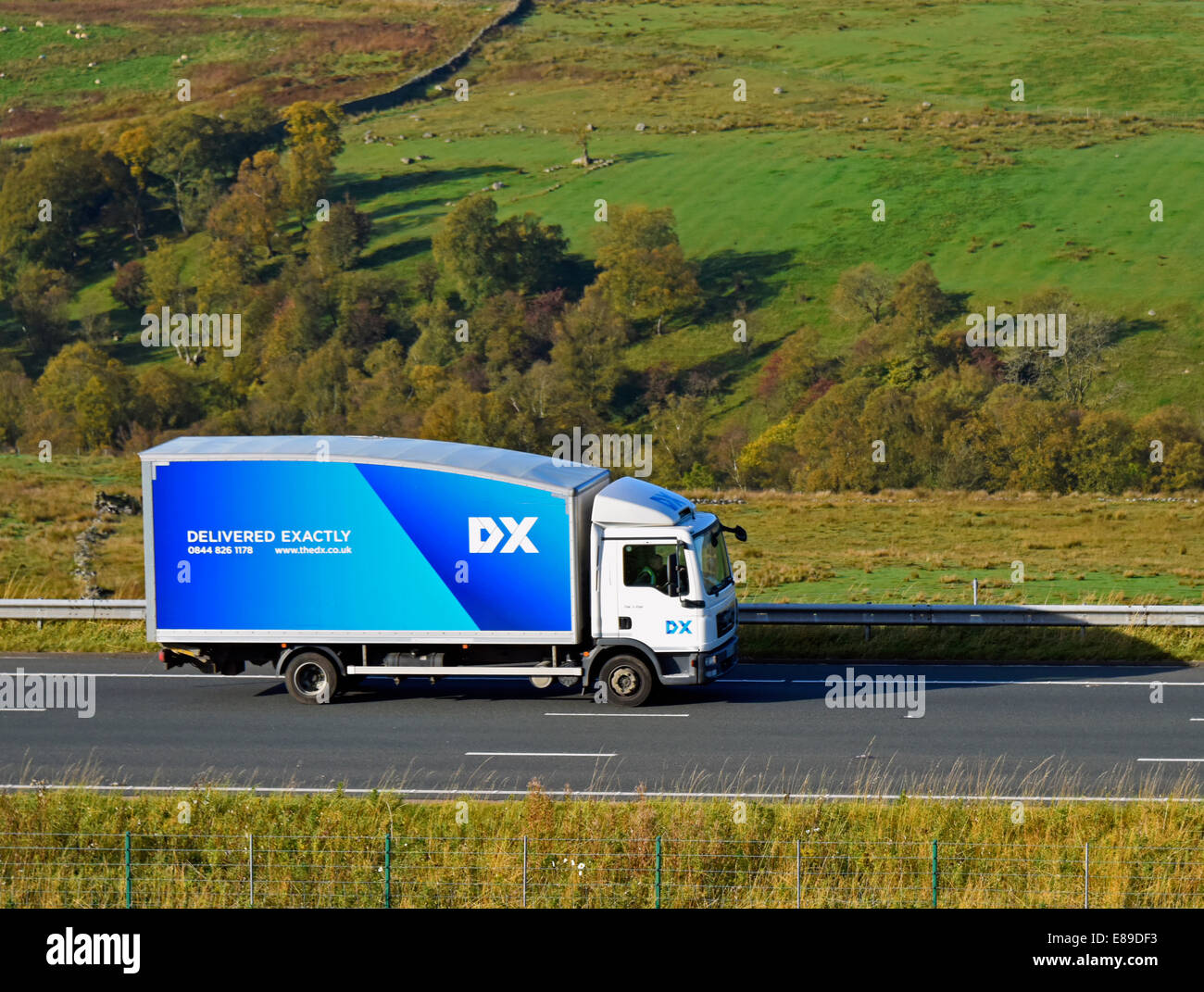 DX Delivered Exactly van. M6 Motorway, northbound. Shap, Cumbria, England, United Kingdom, Europe. Stock Photo
