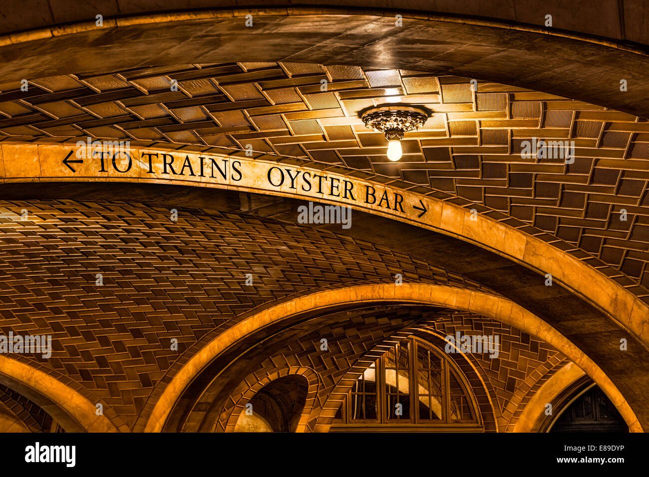 The Oyster Bar and Restaurant exterior showing the Guastavino tiles. Guastavino tile is the 'Tile Arch System' patented in the United States in 1885 by Valencian (Spanish) architect and builder Rafael Guastavino. Guastavino vaulting is a technique for constructing robust, self-supporting arches and architectural vaults using interlocking terracotta tiles and layers of mortar to form a thin skin, with the tiles following the curve of the roof. The iconic landmark of the oyster Bar is located in the lower level of Grand Central Terminal Station in Midtown Manhattan, New York City, New York. Stock Photo