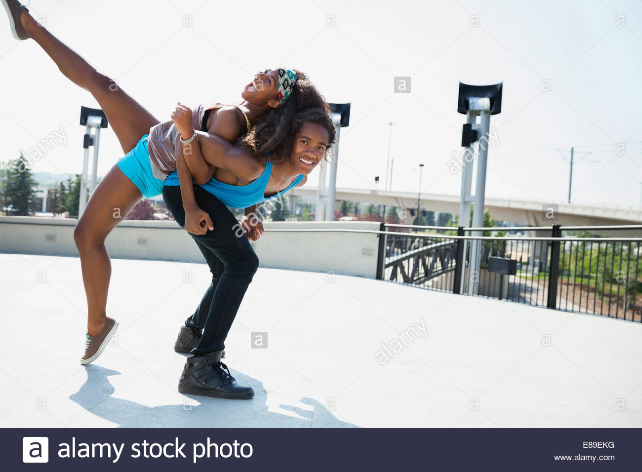 Teenage couple playing outdoors Stock Photo
