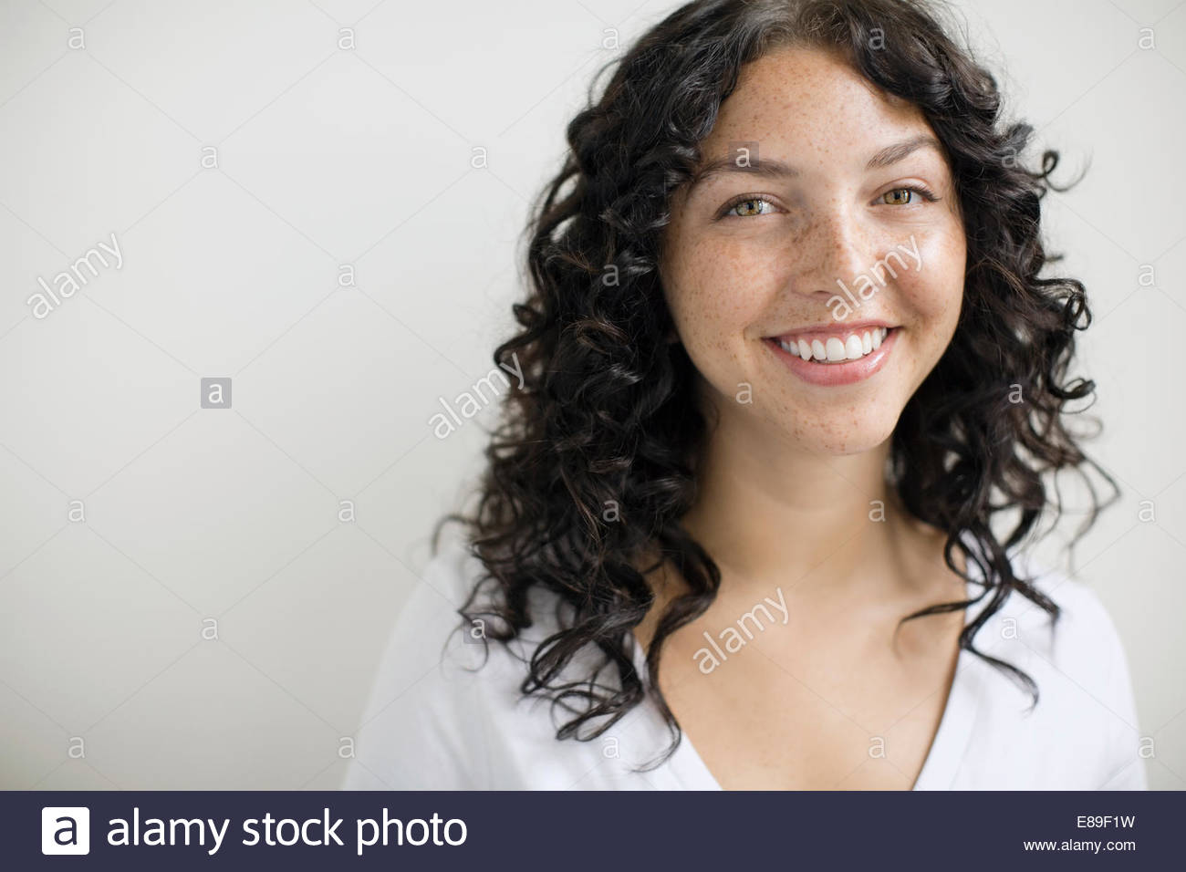 Curly hair woman studio hi-res stock photography and images - Alamy