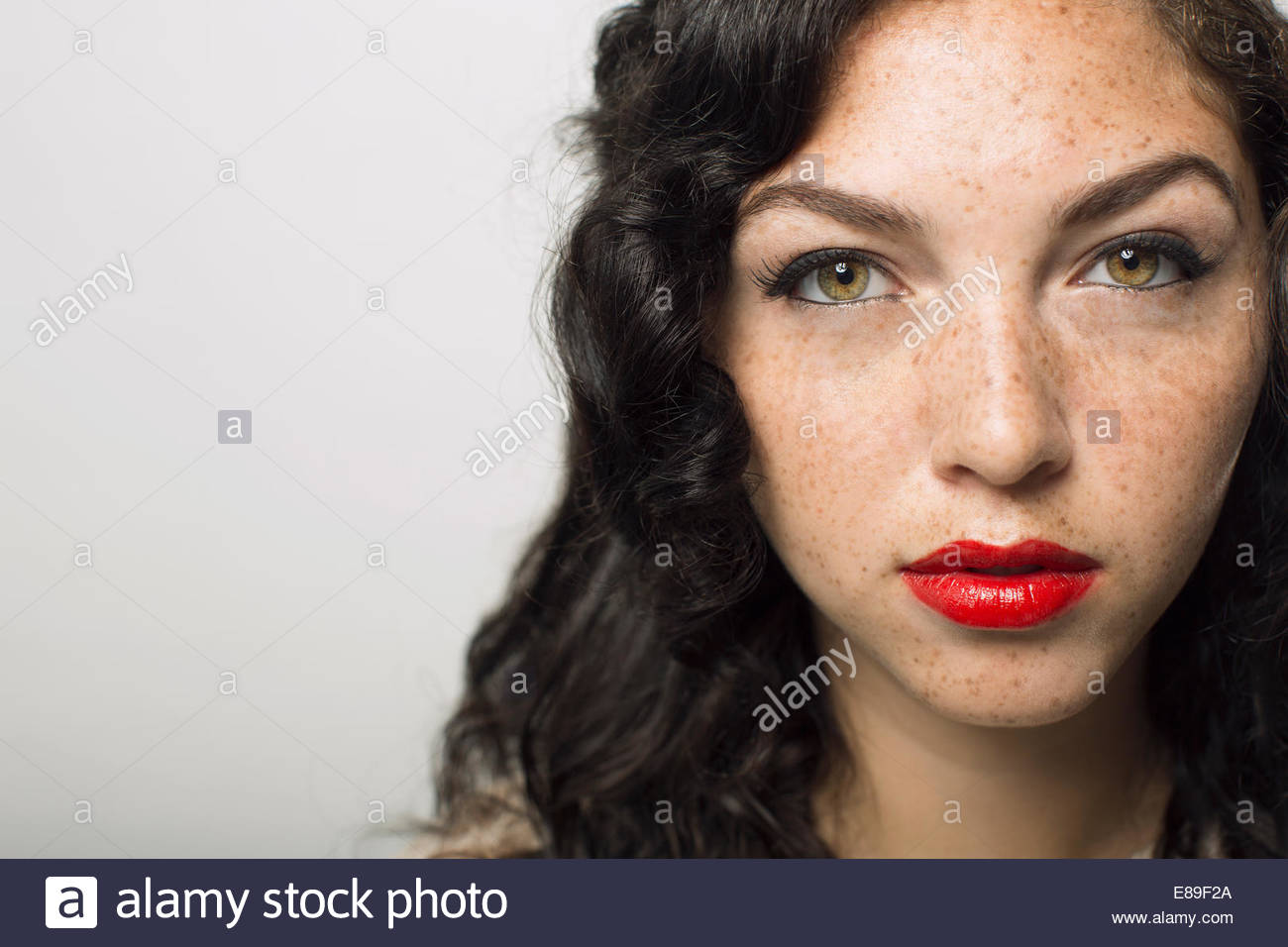 Close up portrait of serious woman with freckles Stock Photo